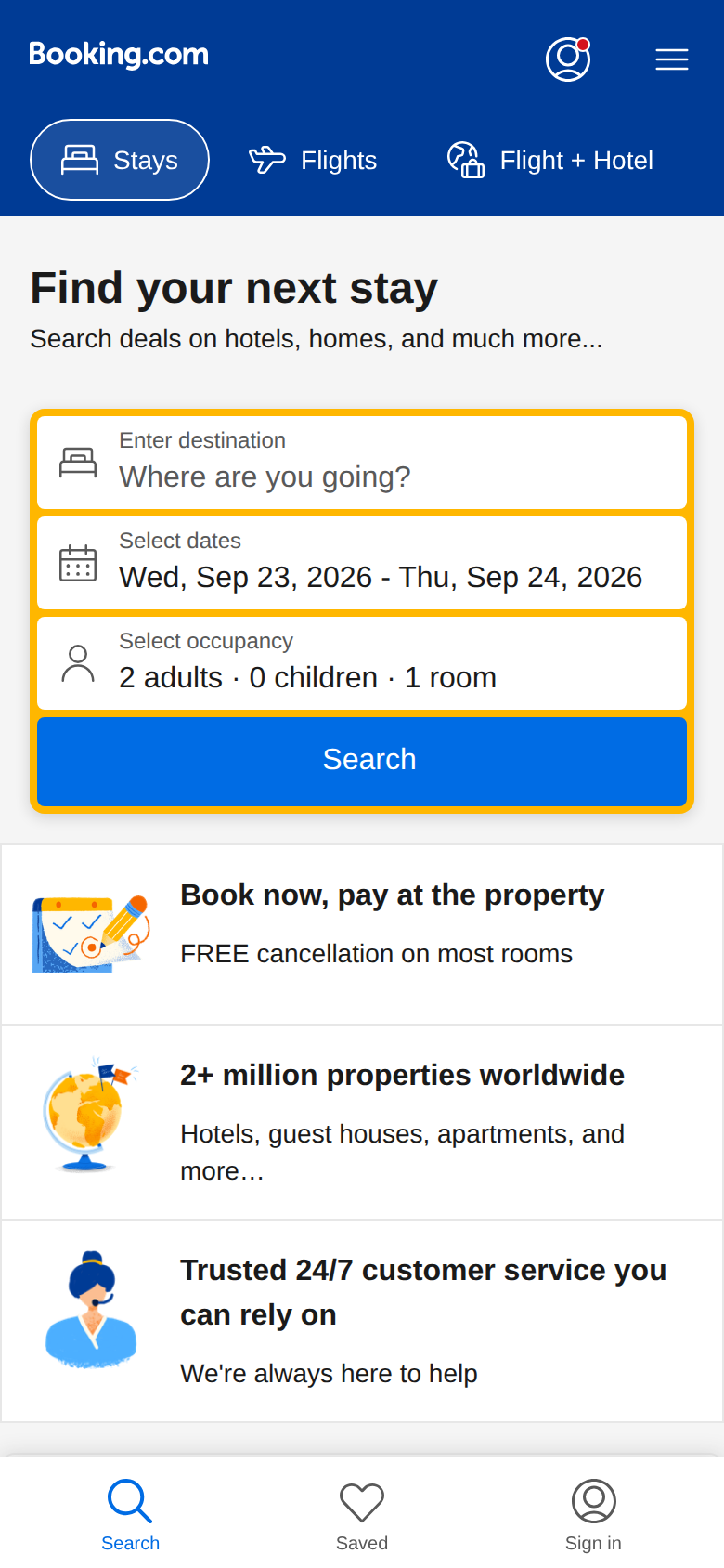 Booking.com mobile homepage on a phone screen with the search box and trust messaging