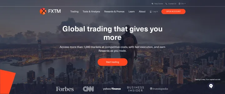 FXTM's homepage headline 'Global trading that gives you more', promising access to more than 1,000 markets with competitive costs and fast execution