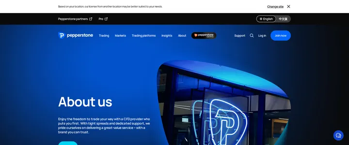 Pepperstone's about us page reading 'About us' above a photo of a Pepperstone neon logo sign at a company office entrance