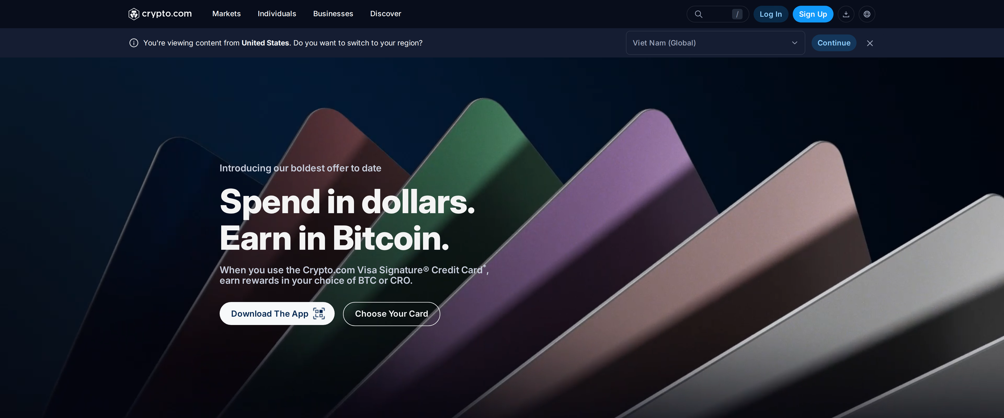 Crypto.com Visa Signature Credit Card marketing page with the tagline "Spend in dollars. Earn in Bitcoin."
