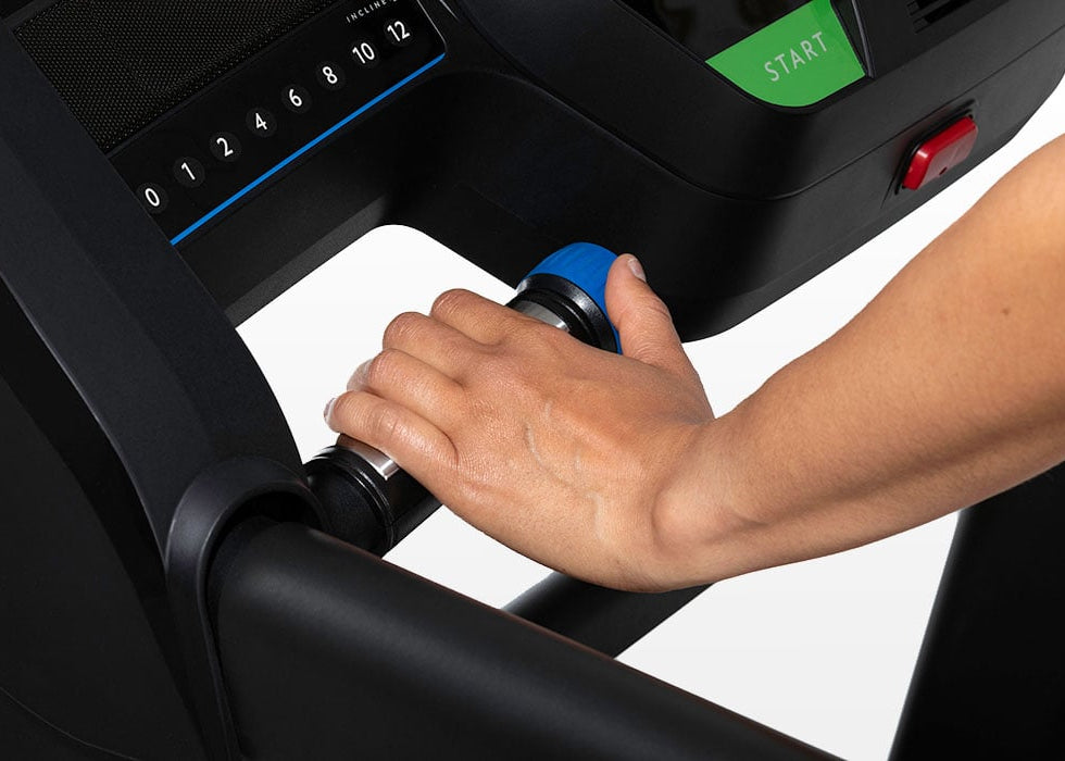 A hand turning the blue speed dial on the Horizon T202